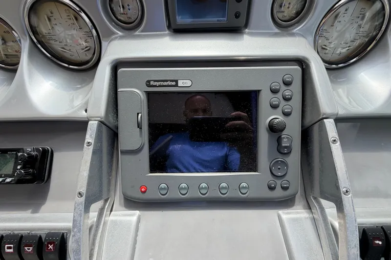 Slide: The Image of Dashboard of a 2007 Monterey 350 Sport Yacht with Raymarine C80 display. - 42