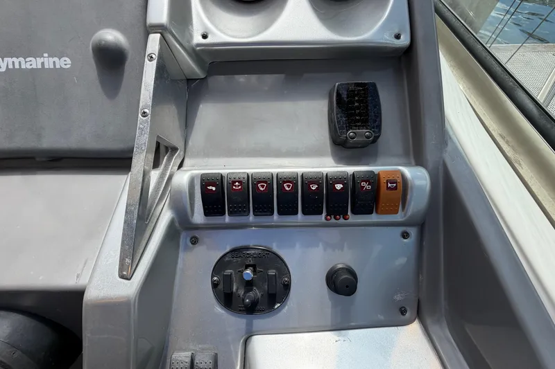 Slide: The Image of Control panel of a 2007 Monterey 350 Sport Yacht with various switches and dials. - 43