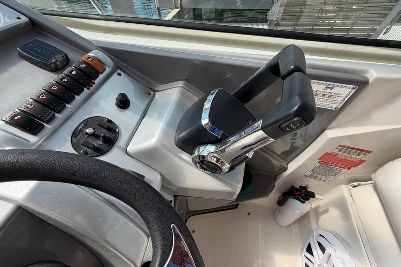 Slide: The Image of Control panel of a 2007 Monterey 350 Sport Yacht with throttle and switches. - 44