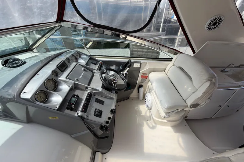 Slide: The Image of Cockpit of 2007 Monterey 350 Sport Yacht with steering wheel and control panel. - 45
