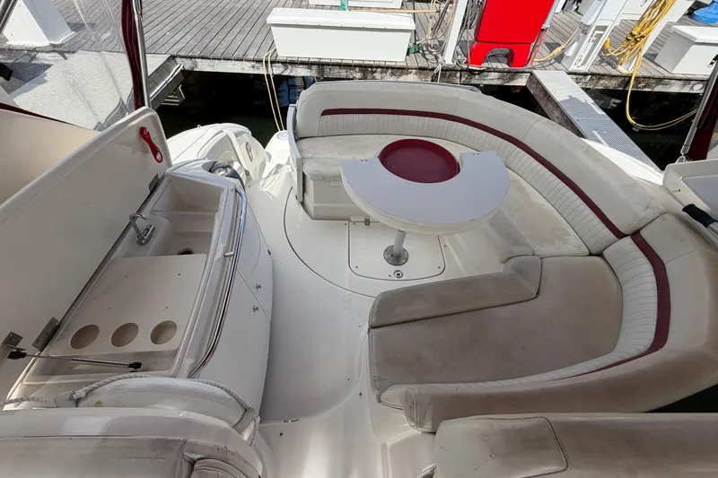 Slide: The Image of 2007 Monterey 350 Sport Yacht interior with curved seating and compact kitchenette. - 48