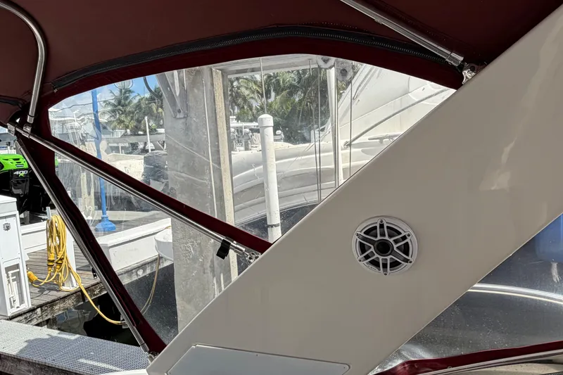 Slide: The Image of Interior view of a 2007 Monterey 350 Sport Yacht, featuring a speaker and marina backdrop. - 49