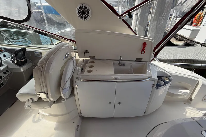Slide: The Image of 2007 Monterey 350 Sport Yacht interior with helm, sink, and seating area. - 52