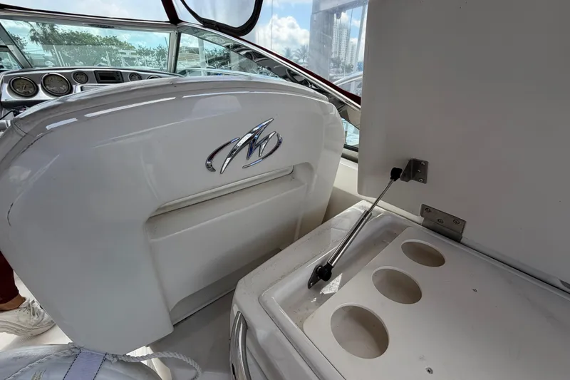 Slide: The Image of 2007 Monterey 350 Sport Yacht interior with dashboard and cup holders. - 54
