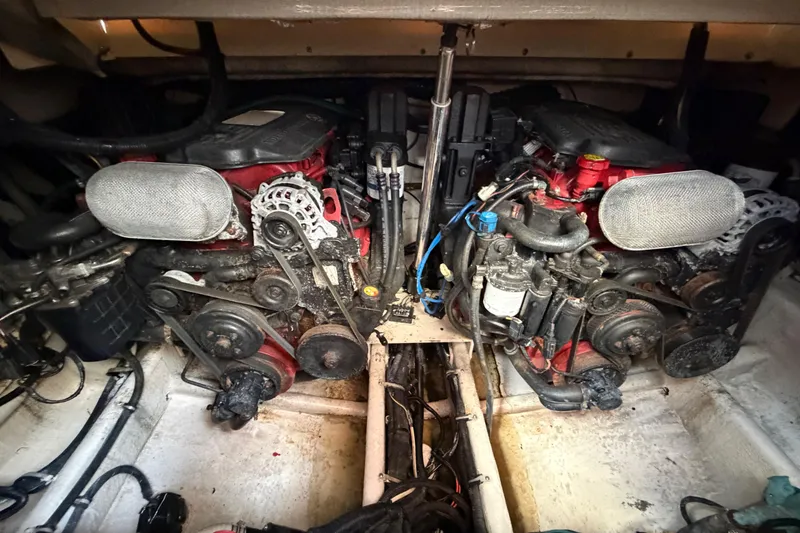 Slide: The Image of Engine compartment of a 2007 Monterey 350 Sport Yacht, showcasing dual engines and mechanical components. - 59