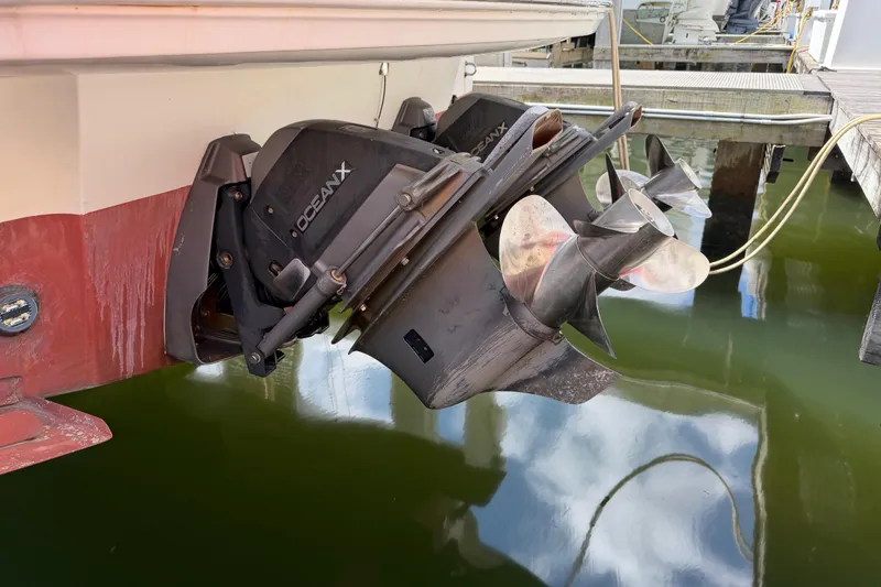 Slide: The Image of Outboard motor of 2007 Monterey 350 Sport Yacht with OceanX drive in marina. - 6