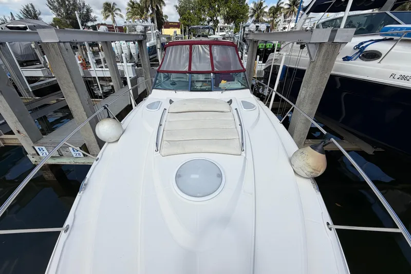 Slide: The Image of 2007 Monterey 350 Sport Yacht docked, featuring sleek design and spacious deck. - 60