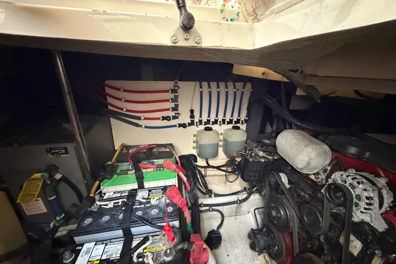 Slide: The Image of Engine compartment of a 2007 Monterey 350 Sport Yacht, showing batteries and wiring. - 62