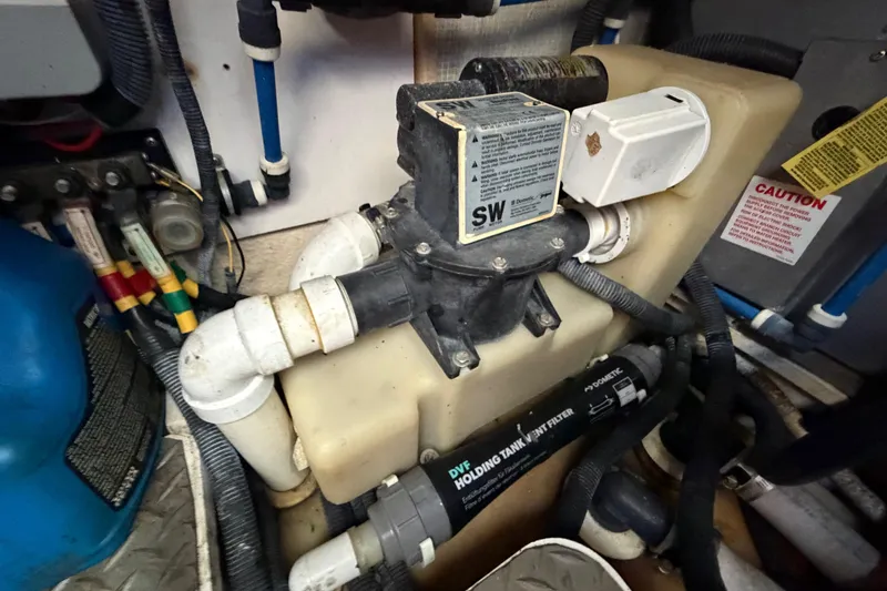 Slide: The Image of Engine room of a 2007 Monterey 350 Sport Yacht showing plumbing and filtration system. - 66