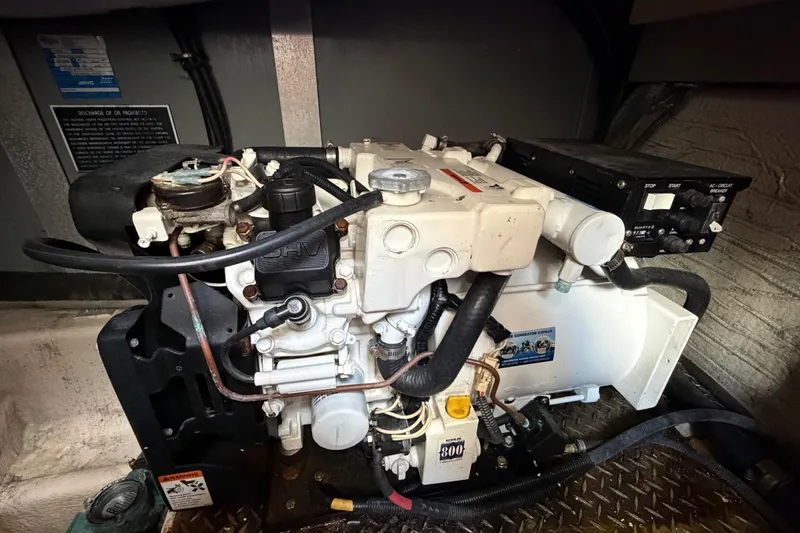 Slide: The Image of Engine compartment of a 2007 Monterey 350 Sport Yacht, showcasing mechanical components and wiring. - 67
