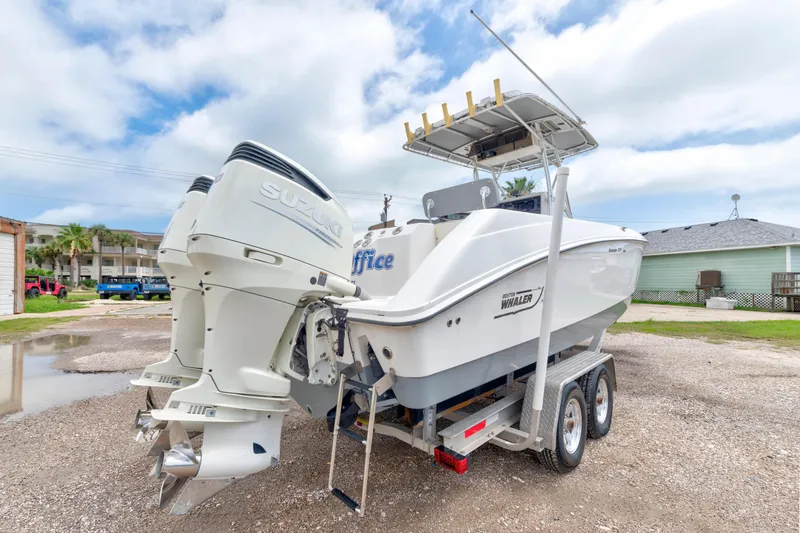 Slide: The Image of 2003 Boston Whaler 270 Outrage boat on trailer with dual Suzuki outboard engines. - 5