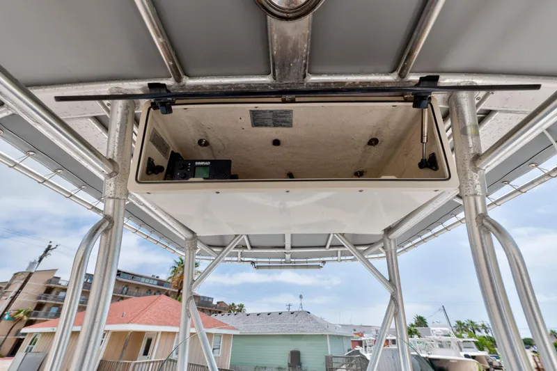 Slide: The Image of Boston Whaler 270 Outrage 2003 boat console with electronics and storage compartment. - 9