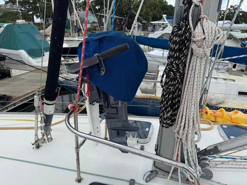 Slide: The Image of Beneteau Oceanis 461 sailboat deck with ropes and covered equipment, docked at marina. - 26