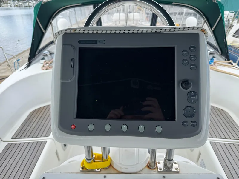 Slide: The Image of Navigation console on a 1997 Beneteau Oceanis 461 sailboat, featuring a control panel. - 29