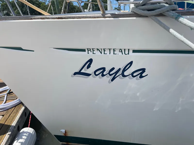 Slide: The Image of Beneteau Oceanis 461 sailboat named "Layla," 1997 model, docked with visible ropes. - 4