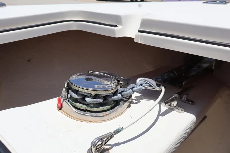 Slide: The Image of 2022 Cobia 301 Center Console anchor windlass detail on deck. - 20