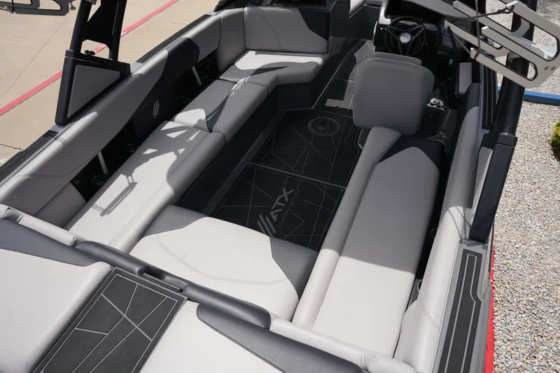 Slide: The Image of Interior of a 2021 ATX 24 Type-S surf boat with gray seating. - 19