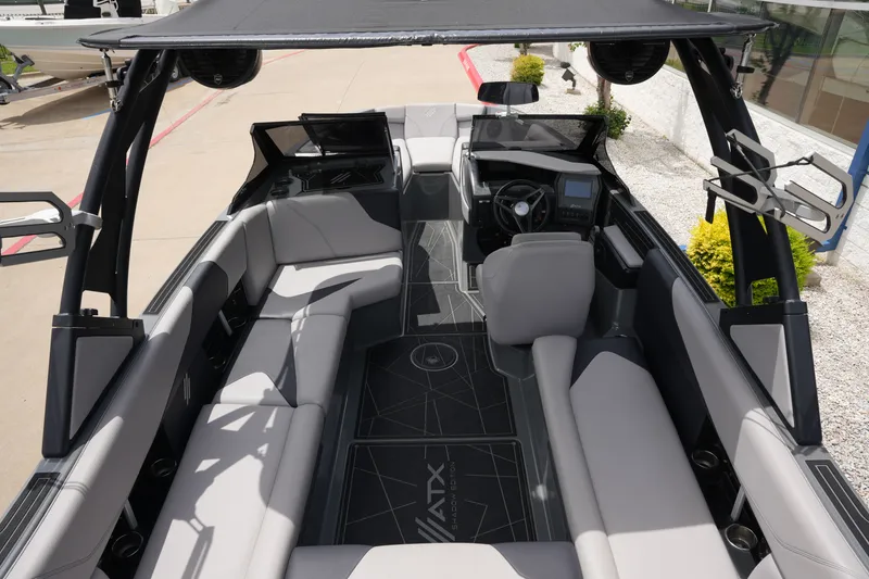 Slide: The Image of Interior of a 2021 ATX 24 Type-S surf boat with gray seating. - 21