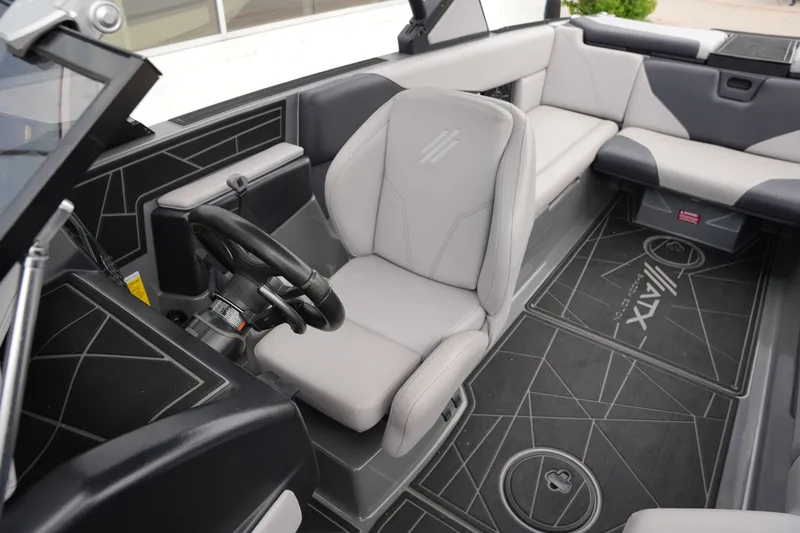 Slide: The Image of Interior of a 2021 ATX 24 Type-S surf boat with gray seating. - 33