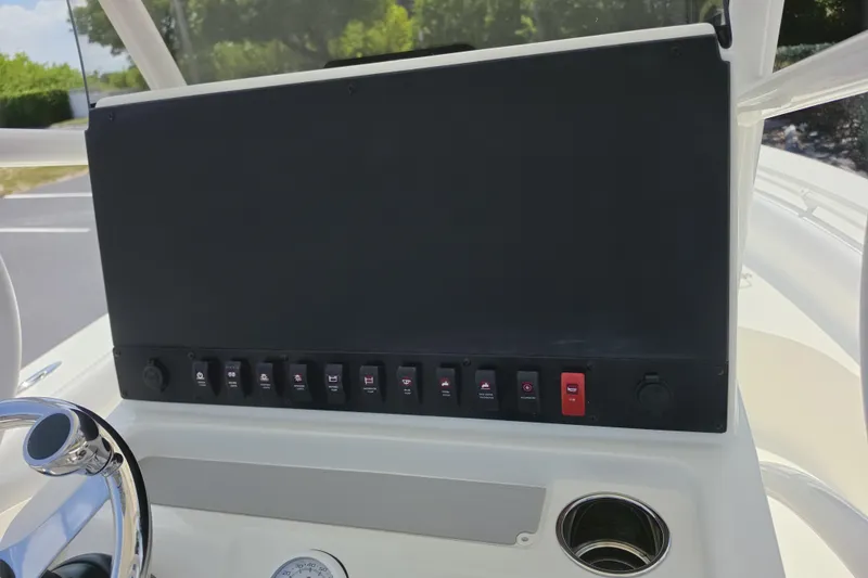 Slide: The Image of 2026 Mako 226 Center Console dashboard with steering wheel and control panel. - 13