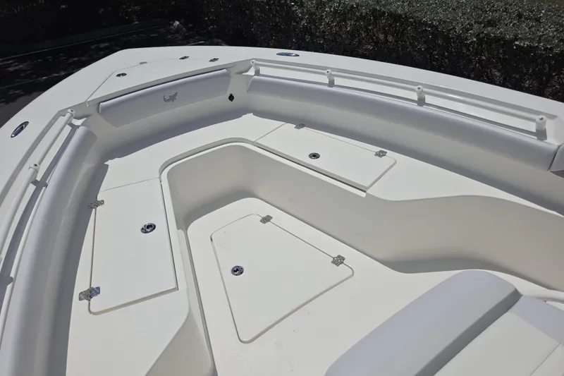 Slide: The Image of 2026 Mako 226 Center Console boat deck with storage compartments and sleek design. - 5