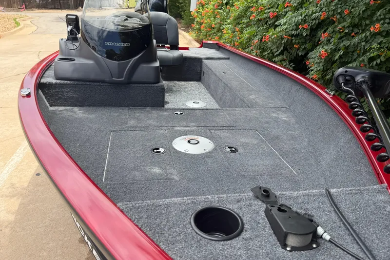 Slide: The Image of 2026 Tracker Super Guide V-16 SC boat with spacious deck and modern console design. - 14