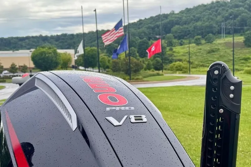 Slide: The Image of 2026 Ranger Z521R Cup-Equipped boat engine with V8 logo, flags in the background. - 7