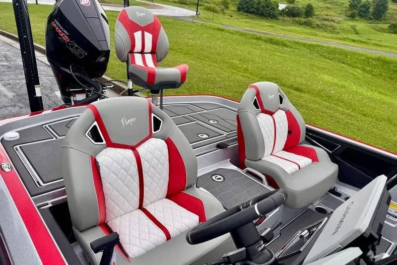 Slide: The Image of 2026 Ranger Z521R Cup-Equipped boat with stylish red and white seating, outdoor setting. - 4