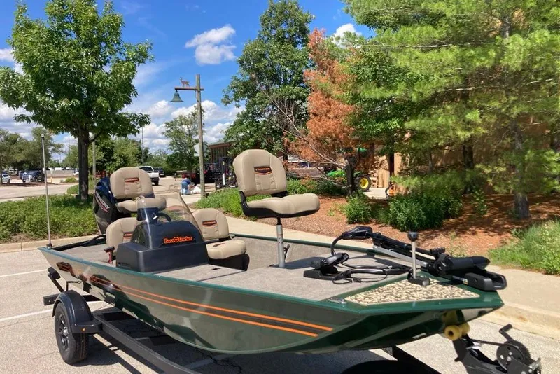 Slide: The Image of 2026 Tracker Bass Tracker Classic Limited boat parked outdoors on a sunny day. - 5