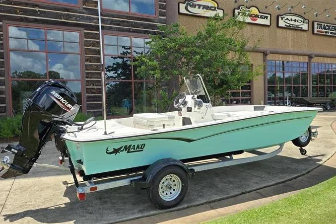 Slide: The Image of 2026 Mako Pro Skiff 17 CC boat on trailer, parked outside dealership. - 7