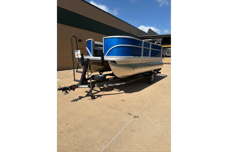The Image of 2026 Sun Tracker Party Barge 16 DLX pontoon boat on trailer, blue exterior. - 0