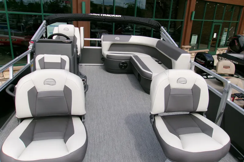 Slide: The Image of 2026 Sun Tracker Bass Buggy 16 XL Select pontoon boat interior with gray seating. - 4