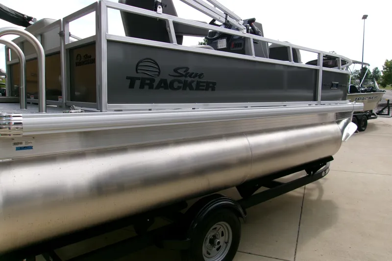 Slide: The Image of 2026 Sun Tracker Bass Buggy 16 XL Select pontoon boat on trailer. - 78