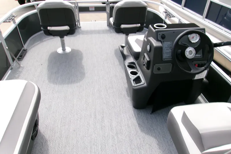 Slide: The Image of 2026 Sun Tracker Bass Buggy 16 XL Select interior with steering console and seating. - 5
