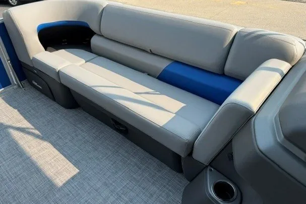 Slide: The Image of 2026 Sun Tracker Party Barge 20 DLX pontoon boat with gray and blue seating. - 10