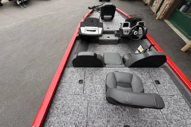 Slide: The Image of 2026 Tracker Pro Team 175 boat interior with gray seating and red accents. - 4