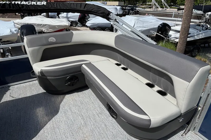 Slide: The Image of 2026 Sun Tracker Bass Buggy 16 XL Select pontoon boat seating area with cup holders. - 79