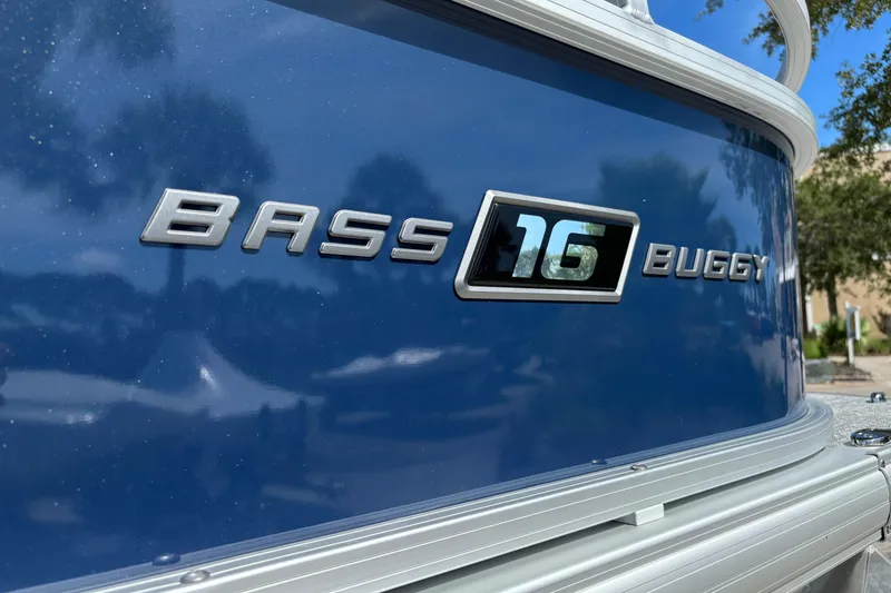Slide: The Image of 2026 Sun Tracker Bass Buggy 16 XL Select boat, blue exterior with model nameplate. - 76