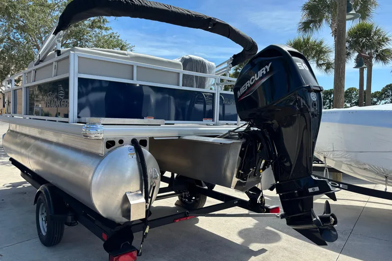 Slide: The Image of 2026 Sun Tracker Bass Buggy 16 XL Select pontoon boat with Mercury outboard motor. - 74