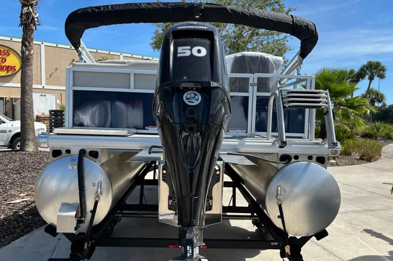 Slide: The Image of 2026 Sun Tracker Bass Buggy 16 XL Select pontoon boat with Mercury 50 engine. - 75