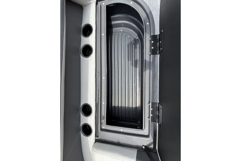 Slide: The Image of 2026 Sun Tracker Bass Buggy 16 XL Select storage compartment with cup holders and hinged lid. - 20