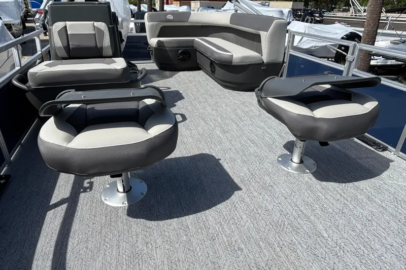 Slide: The Image of 2026 Sun Tracker Bass Buggy 16 XL Select pontoon boat interior with seating arrangement. - 77