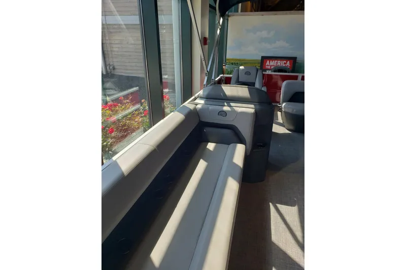 Slide: The Image of Interior of 2026 Sun Tracker Party Barge 18 DLX with comfortable seating and modern design. - 6