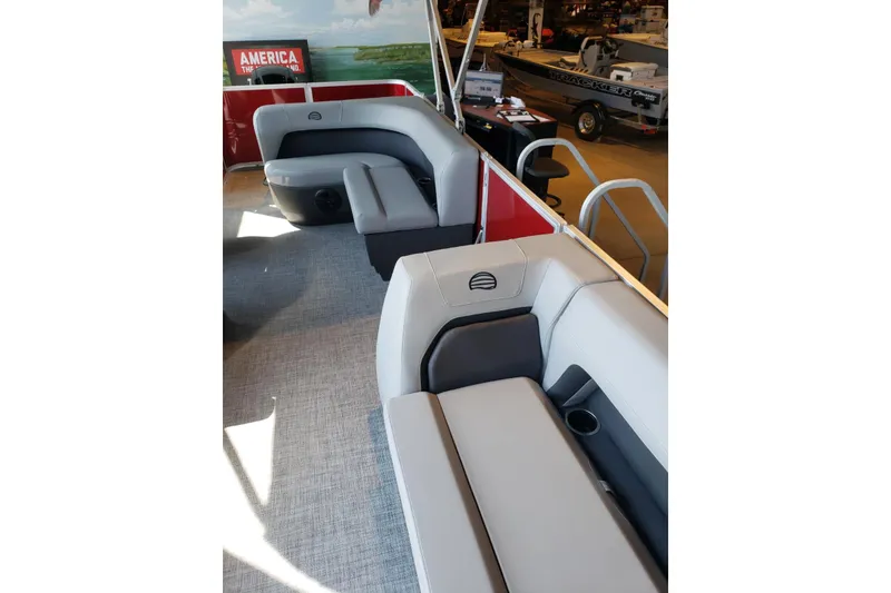 Slide: The Image of 2026 Sun Tracker Party Barge 18 DLX interior with comfortable seating and modern design. - 5