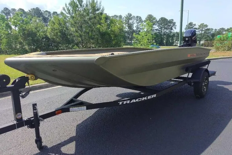 Slide: The Image of 2026 Tracker Grizzly 1756 T Marsh boat on trailer, parked on road. - 11