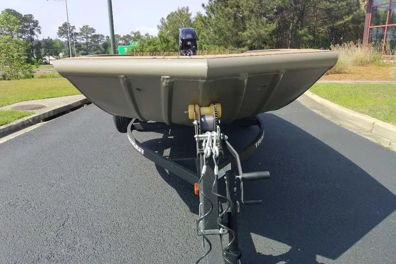 Slide: The Image of Front view of 2026 Tracker Grizzly 1756 T Marsh boat on trailer. - 12