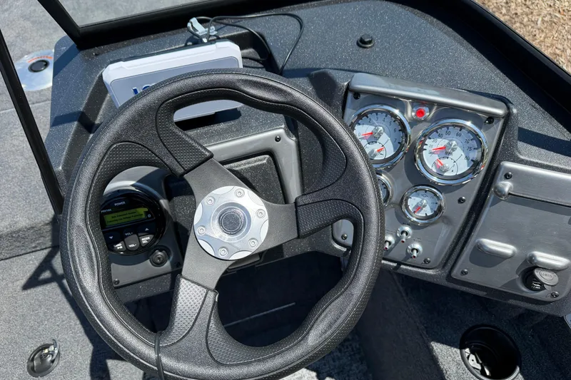 Slide: The Image of 2026 Tracker Pro Guide V-175 WT dashboard with steering wheel and gauges. - 2