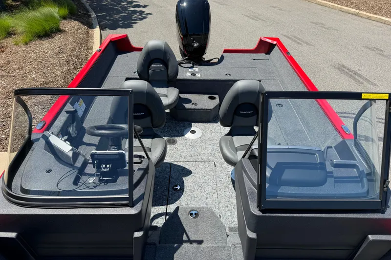Slide: The Image of 2026 Tracker Pro Guide V-175 WT boat interior with dual consoles and seating. - 4