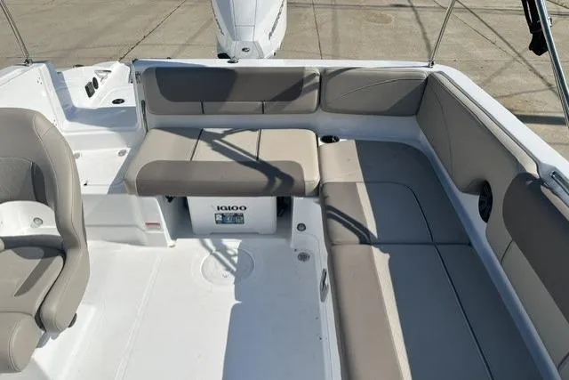 Slide: The Image of 2026 Tahoe 2150 boat interior with beige seating and spacious layout. - 6