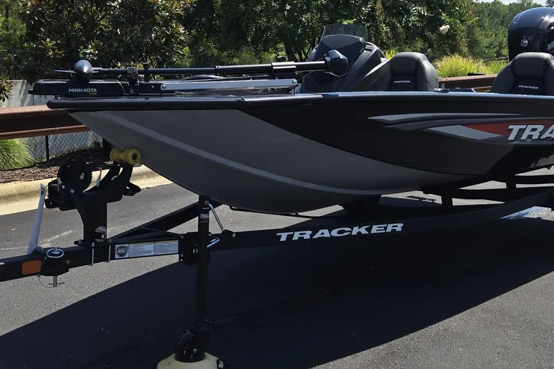The Image of 2026 Tracker Pro Team 175 boat on trailer, parked outdoors. - 0